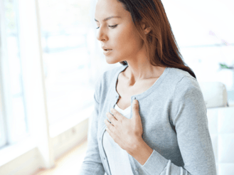 woman-blue-sweater-breathing-issues-indoor-air